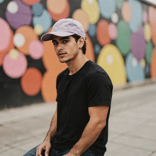 View of a relaxed fit performance hat in light gray, featuring a wide brim and breathable fabric for sun protection