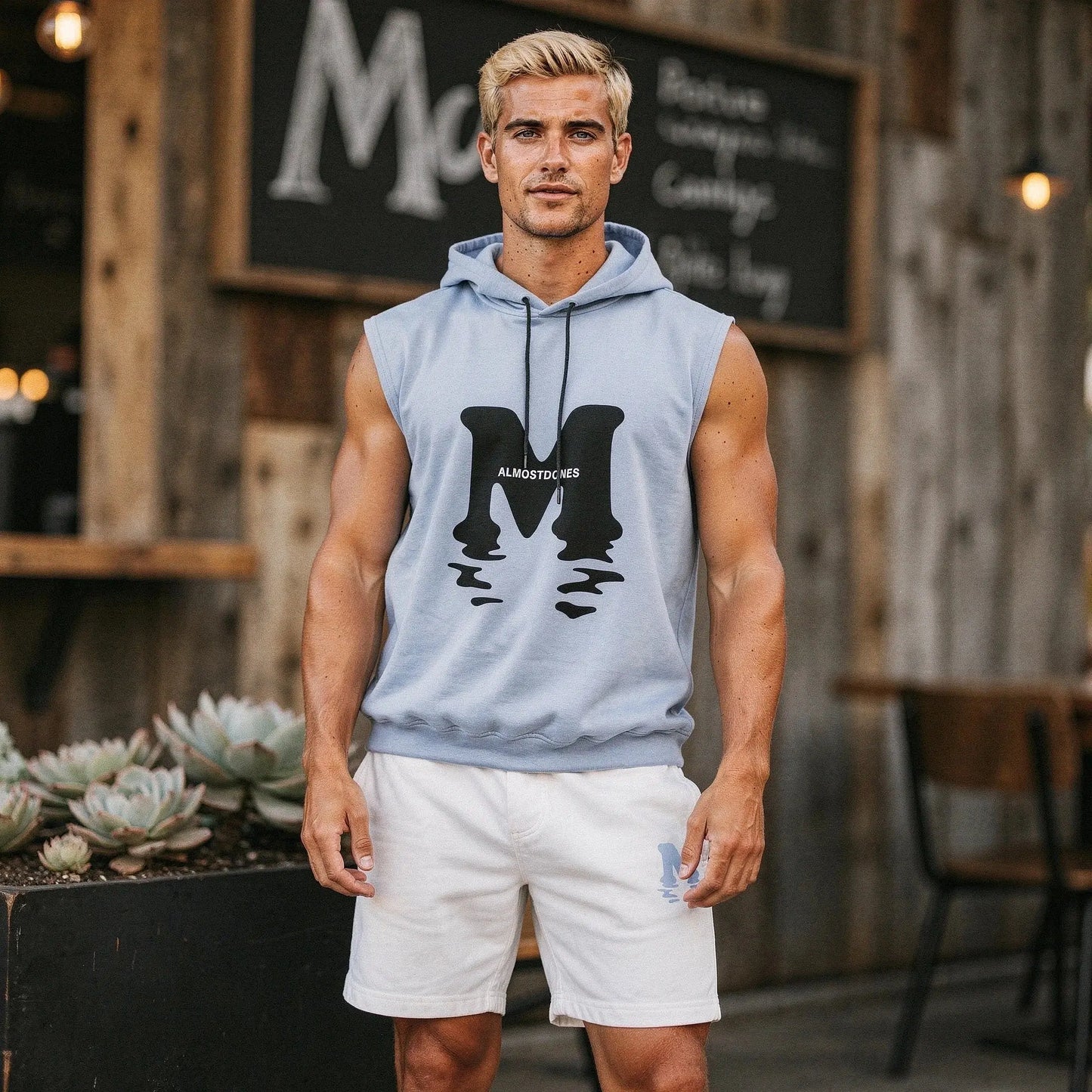 Light gray sleeveless casual t shirt paired with matching shorts, featuring a relaxed fit and soft cotton material, view