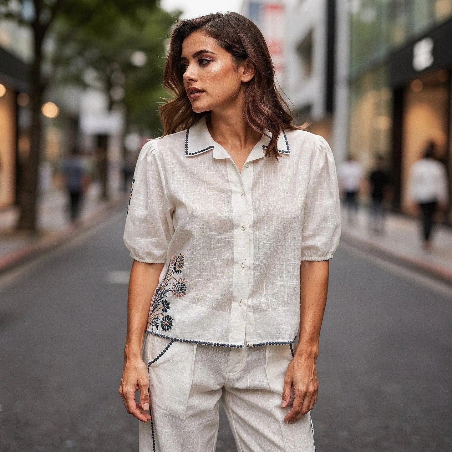 Light blue short sleeve button down shirt with floral embroidery, view showcasing relaxed fit and casual style