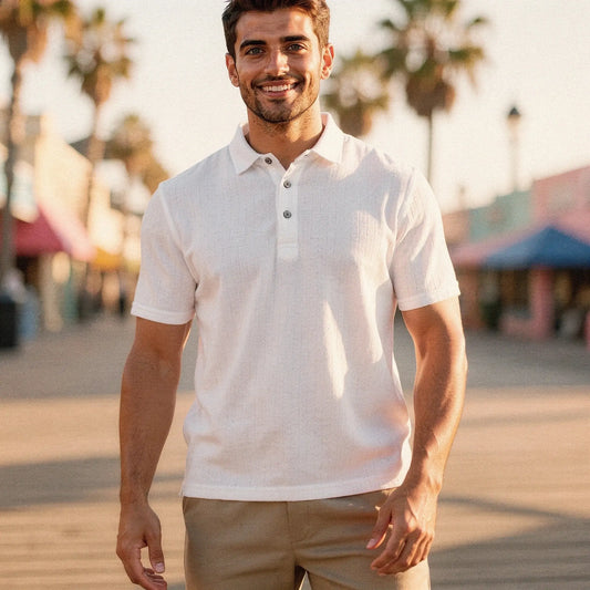 View of a slim fit short sleeve polo shirt in dark blue, featuring a V neck and soft cotton material