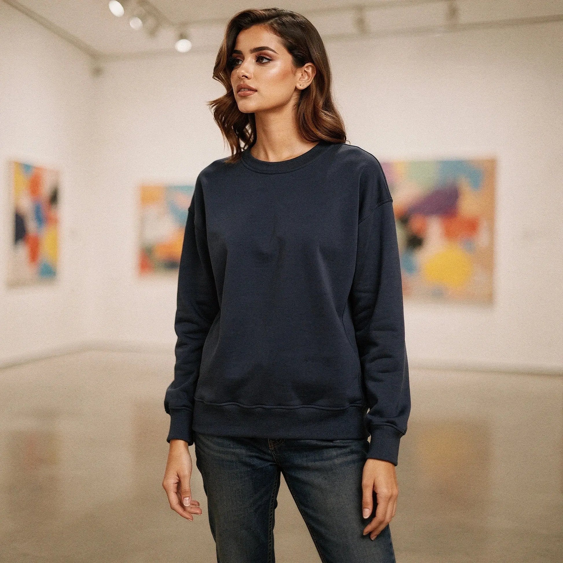 Light gray relaxed fit crew neck sweatshirt with long sleeves and soft fabric, view showcasing stitching and neckline