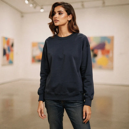 Light gray relaxed fit crew neck sweatshirt with long sleeves and soft fabric, view showcasing stitching and neckline