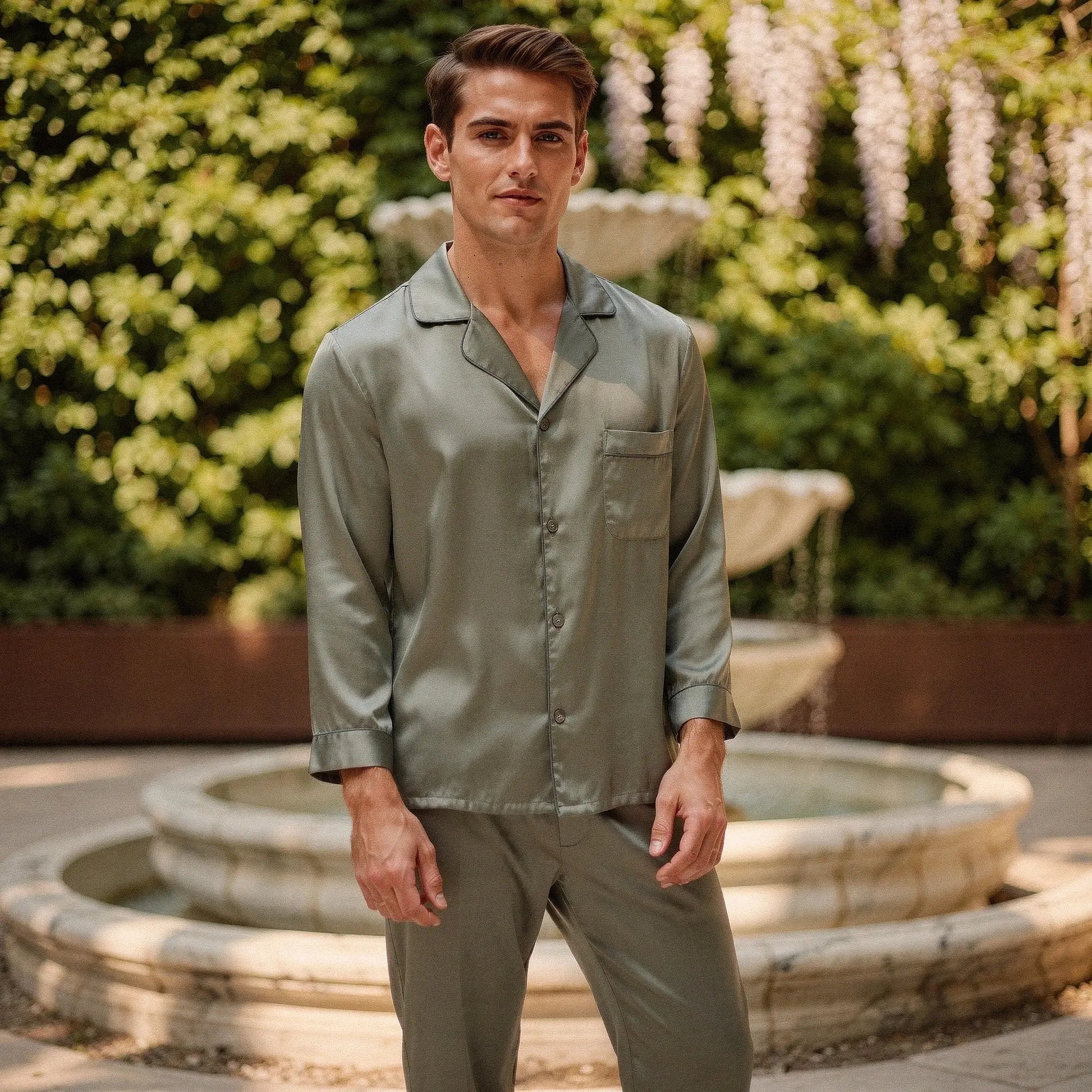 View of a relaxed fit long sleeve pajama set in pure silk, featuring a notch collar and soft drape in a deep navy color