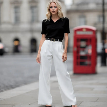 View of relaxed fit wide leg full length casual pants in soft beige fabric, featuring a comfortable waistband and flowing silhouette