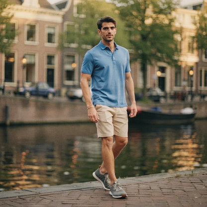 View of a slim fit short sleeve polo shirt in light gray, featuring a V neck and soft cotton material