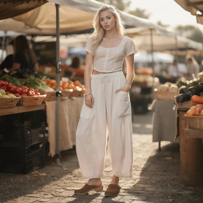 View of relaxed fit high rise wide leg comfort pants in soft fabric, featuring a neutral beige color and a smooth waistband
