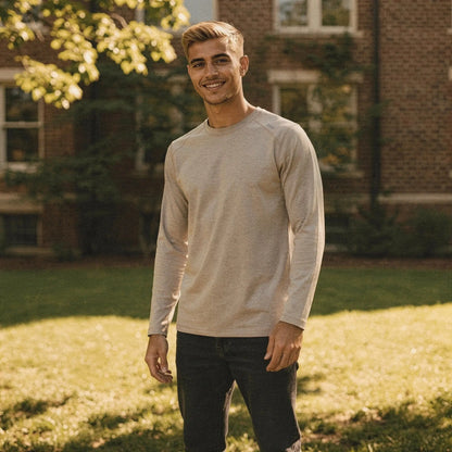 View of a relaxed fit crew neck long sleeve t shirt in dark gray, made of soft cotton fabric, showcasing the stitching and sleeve design