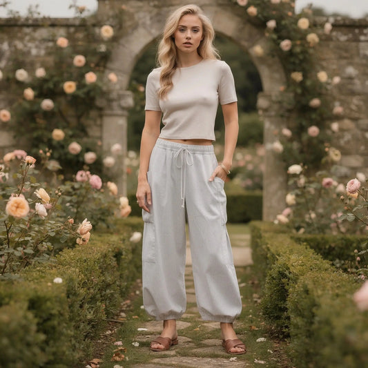 View of relaxed fit high rise wide leg comfort pants in light gray fabric, featuring a simple and casual design