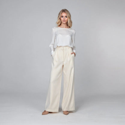 View of relaxed fit high waist wide leg casual pants in soft beige fabric, perfect for spring wear