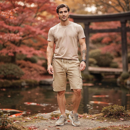 View of relaxed fit baggy cargo shorts in khaki, featuring a drawstring waist and multiple pockets