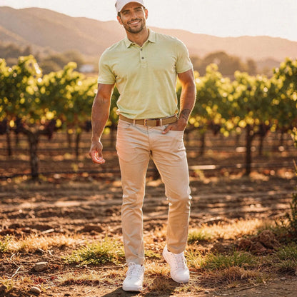 View of a slim fit short sleeve v neck polo shirt in light gray, featuring a soft cotton blend fabric and subtle stitching