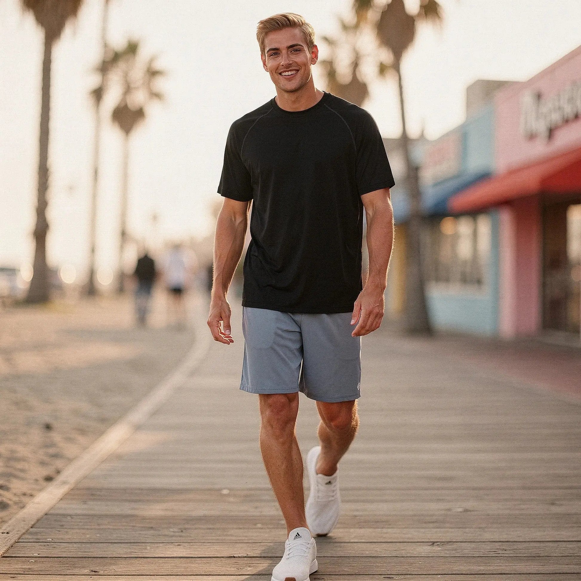 View of gray relaxed fit workout shorts with an elastic waistband and 7 inch inseam, made