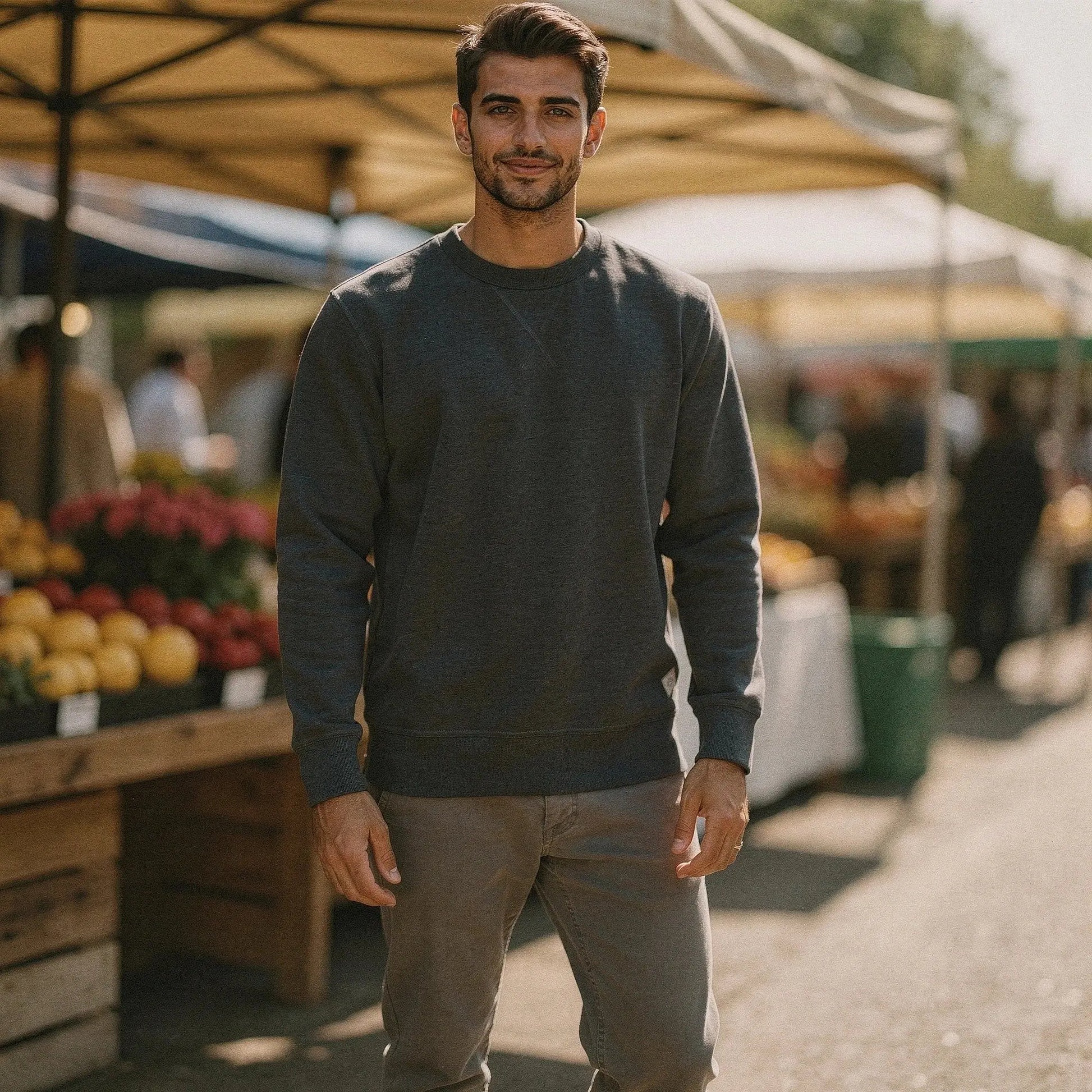View of a relaxed fit crew neck long sleeve sweatshirt in gray, featuring ribbed cuffs and soft cotton material