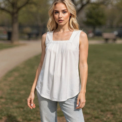 View of a relaxed fit sleeveless midi summer top in soft cotton, featuring a light pastel color and subtle stitching details