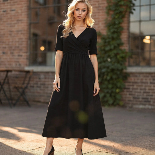 View of a sleek black midi dress featuring a slim fit and elegant V neck design, made
