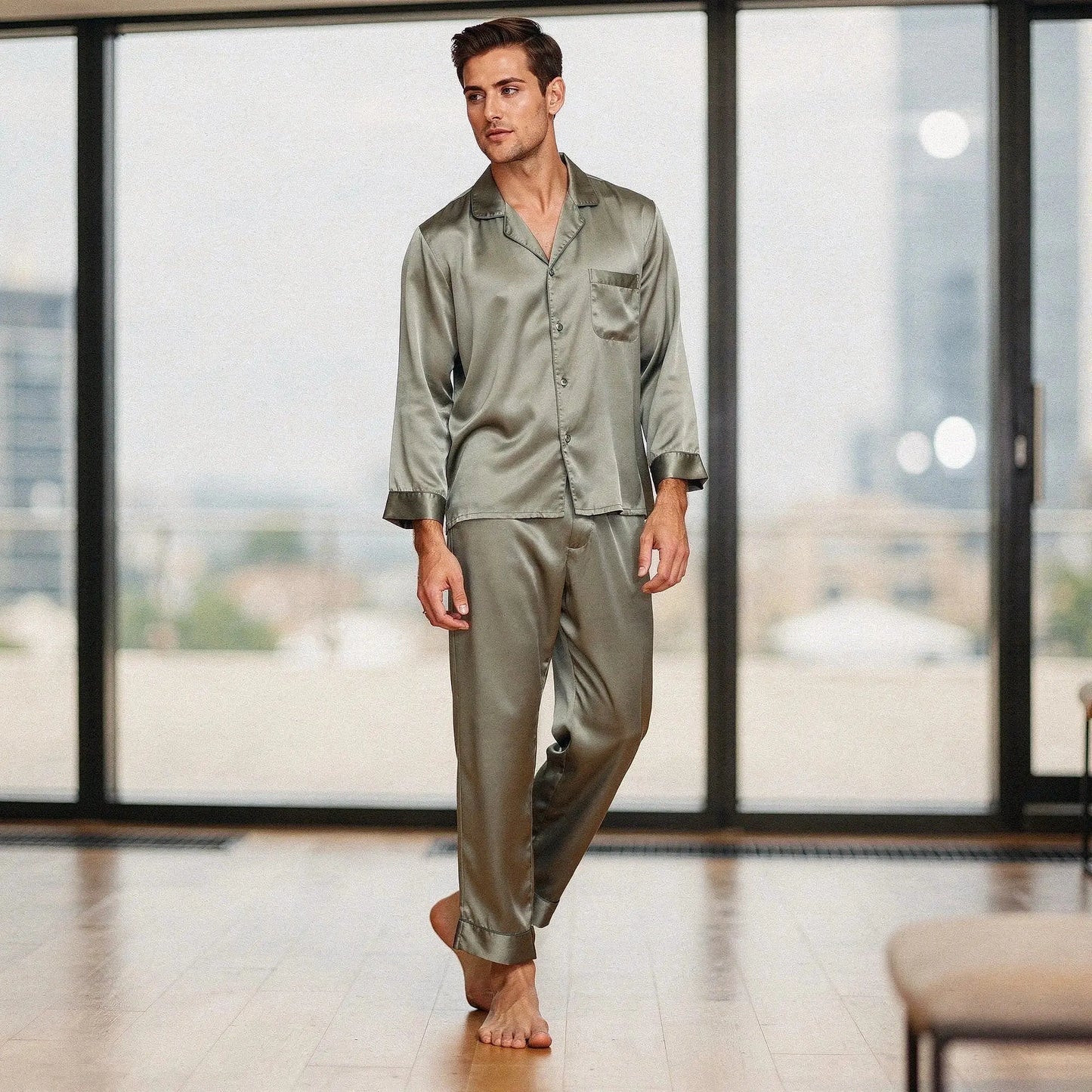 View of a relaxed fit long sleeve pajama set in pure silk, featuring a notch collar and smooth fabric in a deep navy color