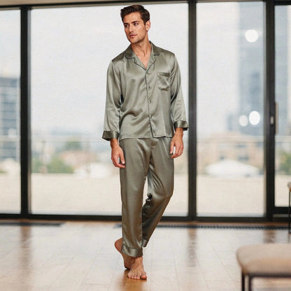 View of a relaxed fit long sleeve pajama set in pure silk, featuring a notch collar and smooth fabric in a deep navy color