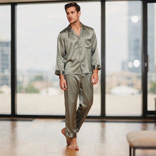 View of a relaxed fit long sleeve pajama set in pure silk, featuring a notch collar and smooth fabric in a deep navy color