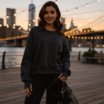 Light gray relaxed fit crew neck sweatshirt with long sleeves and soft fabric, view showcasing stitching and neckline