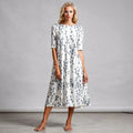 View of a relaxed fit A line midi dress in soft fabric, featuring a flattering silhouette and casual chic style