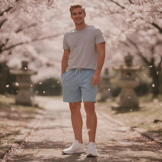 View of relaxed fit men's workout shorts in dark gray, featuring an elastic waistband and 7 inch inseam