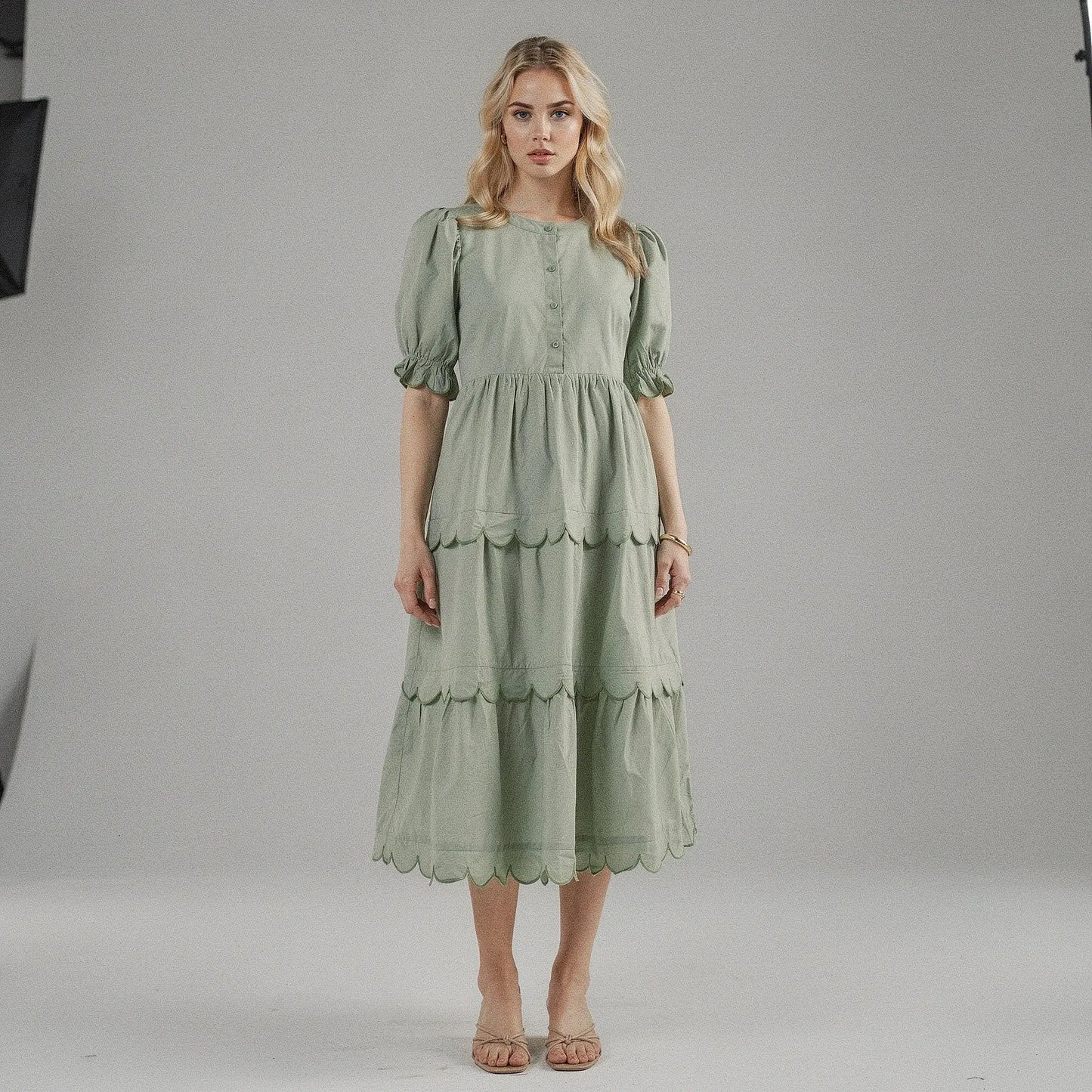 View of a flowy A line midi dress in soft fabric, featuring a round neck and short sleeves, perfect for summer occasions