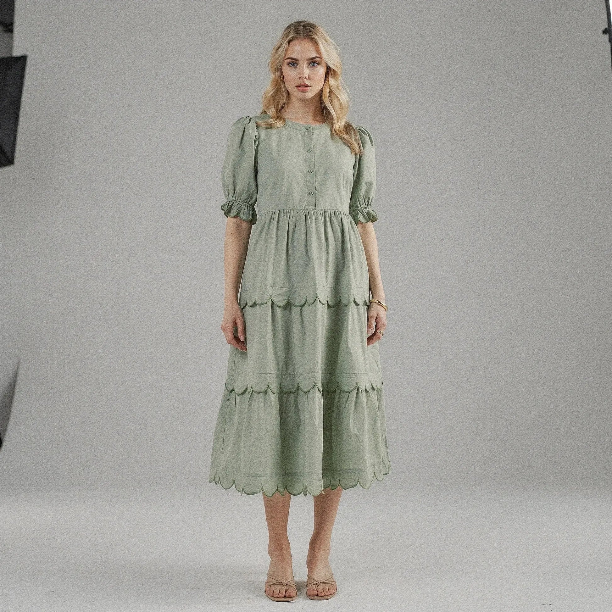 View of a flowy A line midi dress in soft fabric, featuring a round neck and short sleeves, perfect for summer occasions