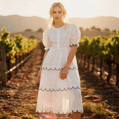 View of a flowy A line midi dress in soft fabric, featuring a round neck and vibrant floral pattern, perfect for summer occasions