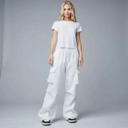 View of relaxed fit wide leg cargo pants in olive green, featuring multiple pockets and a comfortable waistband