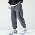 View of relaxed fit tapered joggers in soft beige corduroy with a drawstring waist and pockets