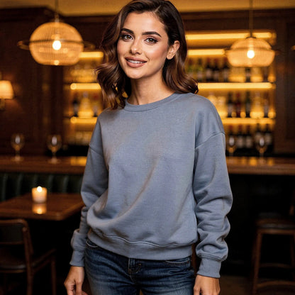 Light gray relaxed fit crew neck sweatshirt with long sleeves and ribbed cuffs, view showcasing fabric texture