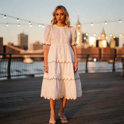 View of a flowy A line midi dress in soft fabric, featuring a round neck and delicate floral pattern, perfect for summer occasions