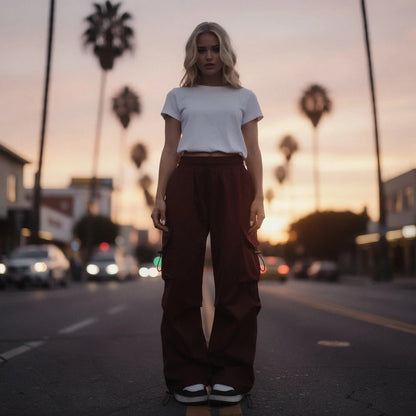 View of relaxed fit wide leg cargo pants in olive green, featuring large pockets and a comfortable waistband