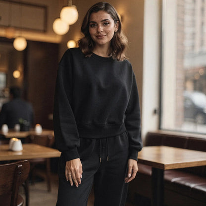 Light gray relaxed fit crew neck sweatshirt with long sleeves and ribbed cuffs, view showcasing fabric texture