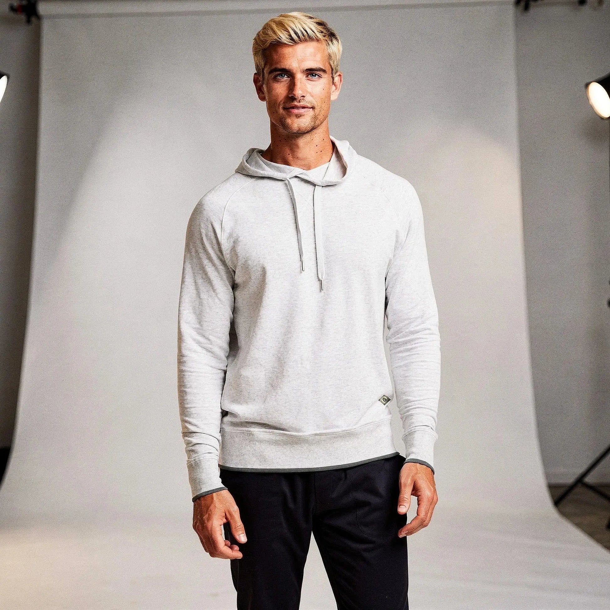 View of a relaxed fit crew neck long sleeve casual hoodie in light gray, featuring a soft fabric and ribbed cuffs