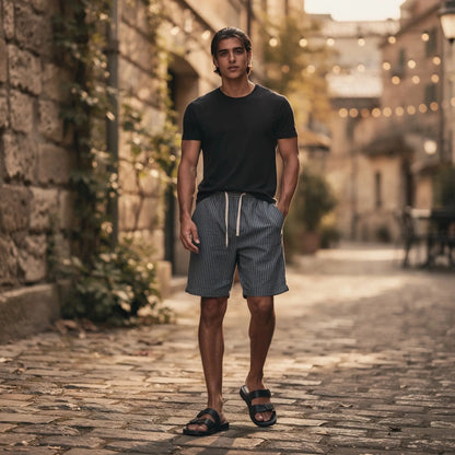 View of relaxed fit summer shorts featuring navy and white stripes, drawstring waist, and lightweight fabric