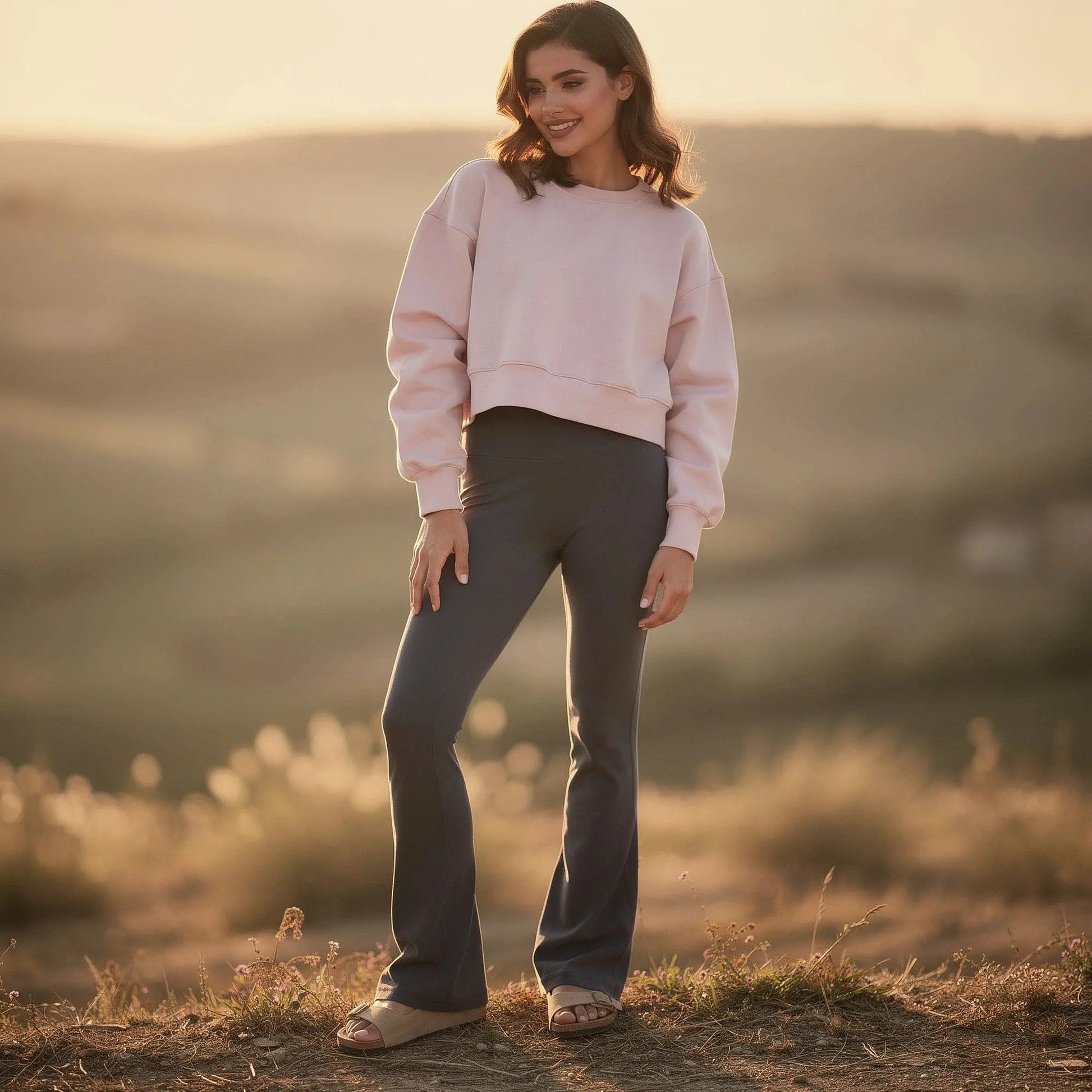 Light gray relaxed fit crew neck sweatshirt with long sleeves and ribbed cuffs, view showcasing fabric texture