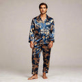 View of a relaxed fit long sleeve silk pajama set in deep navy blue with a notch collar and button up