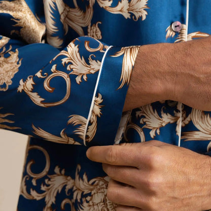 View of relaxed fit long sleeve silk pajamas set in deep navy blue, featuring a notch collar and elegant sheen