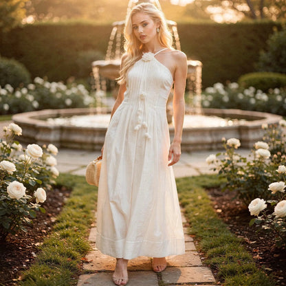 View of a relaxed fit halter maxi dress in soft fabric, featuring a floral print and flowing skirt, perfect for summer occasions