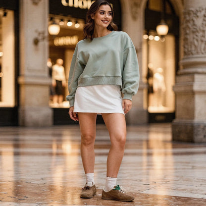 Light gray relaxed fit crew neck sweatshirt with long sleeves and soft fabric, detailed view of the neckline and sleeve