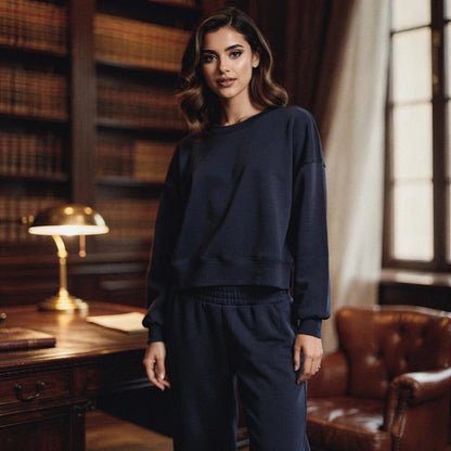 Light gray relaxed fit crew neck sweatshirt with long sleeves and soft fabric, view showcasing stitching and neckline