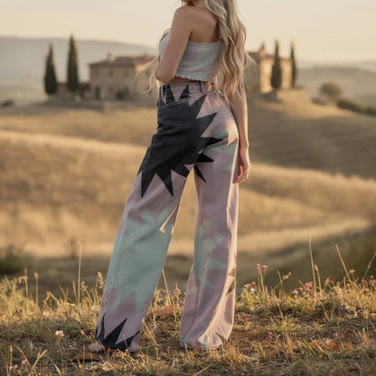 View of women's wide leg pants featuring a geometric print in soft fabric, showcasing a relaxed fit and comfortable waistband