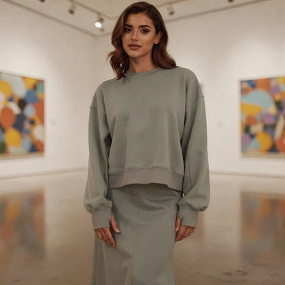 Light gray long sleeve casual sweatshirt featuring a relaxed fit and crew neck, detailed view showing fabric texture