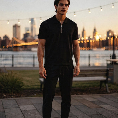 View of a slim fit short sleeve sport suit set in dark gray, featuring a zippered and lightweight fabric