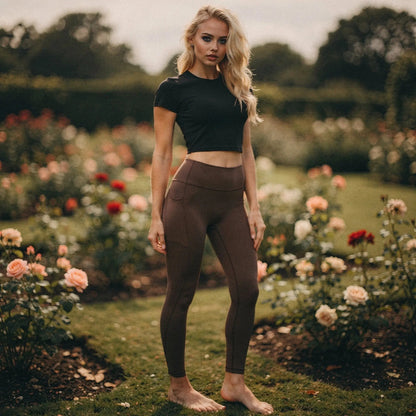 View of high waisted fitted 78 leggings in black, featuring pockets and a stretchy, breathable fabric