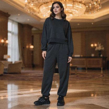 Light gray relaxed fit crew neck sweatshirt with long sleeves and soft fabric, view showcasing stitching and neckline