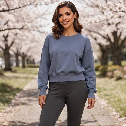 View of a relaxed fit crew neck long sleeve casual sweatshirt in light gray, featuring soft fabric and ribbed cuffs