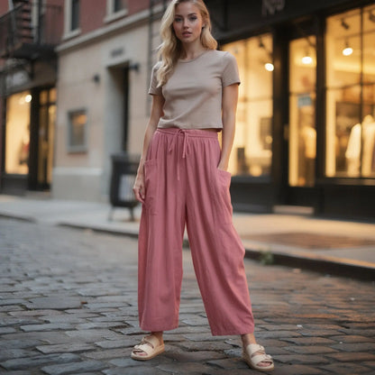 View of relaxed fit high rise wide leg comfort pants in soft fabric, featuring a neutral beige color and a smooth waistband