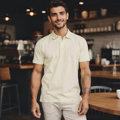 View of a navy blue slim fit short sleeve polo shirt featuring a V neck and soft cotton material